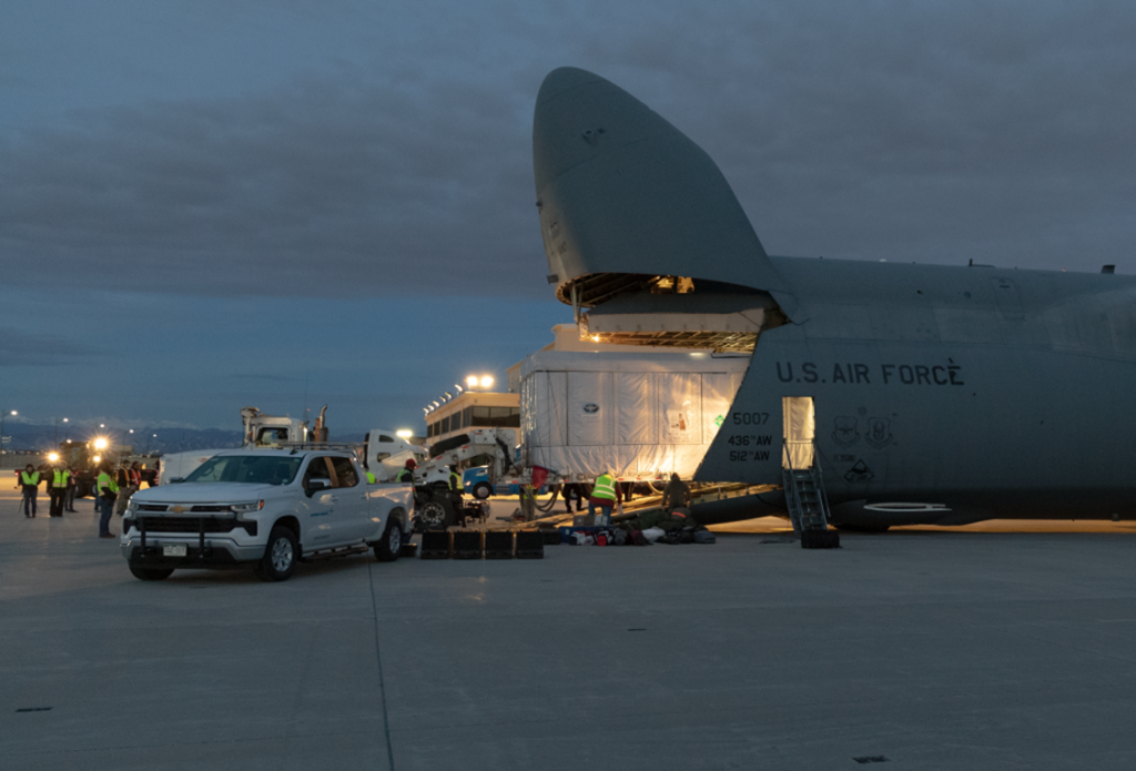 Photograph of the GOES-U satellite loading into a U.S. Air Force jet for transit.