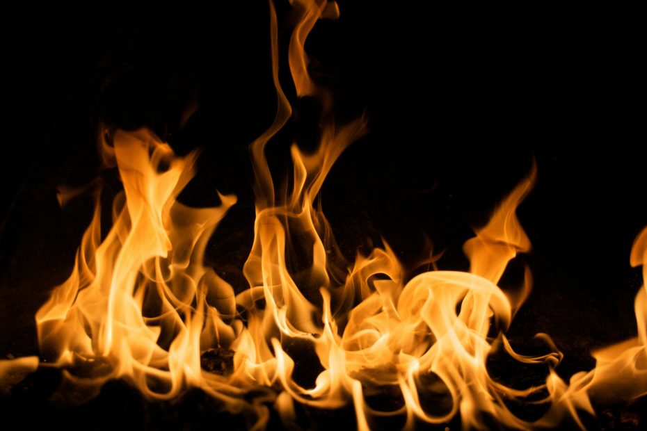 A picture of a fire in front of a black background.