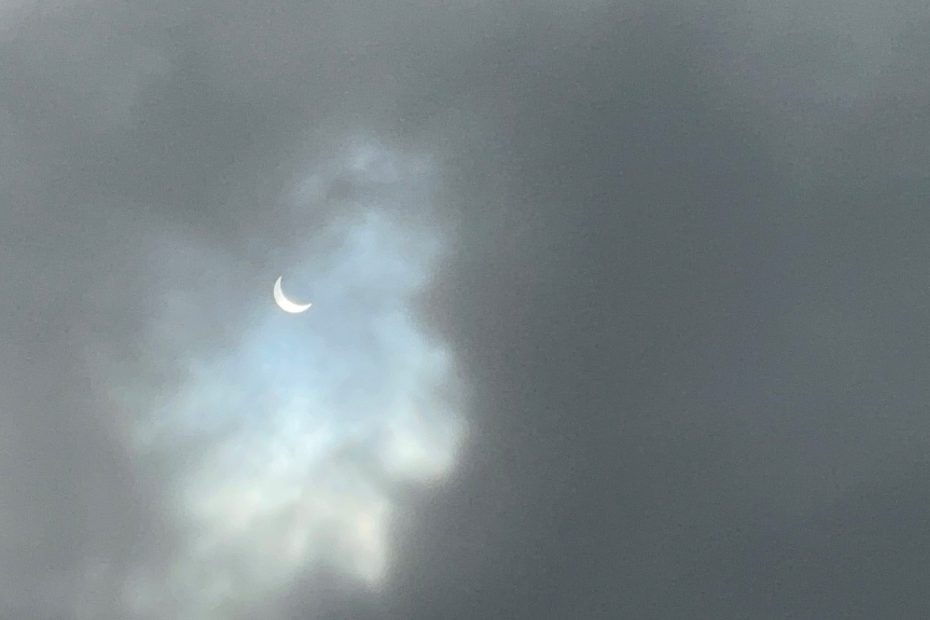 Image of April 8th, 2024 Total Solar Eclipse in Dallas, TX through the clouds taken by Meteorologist Shannon Holland.