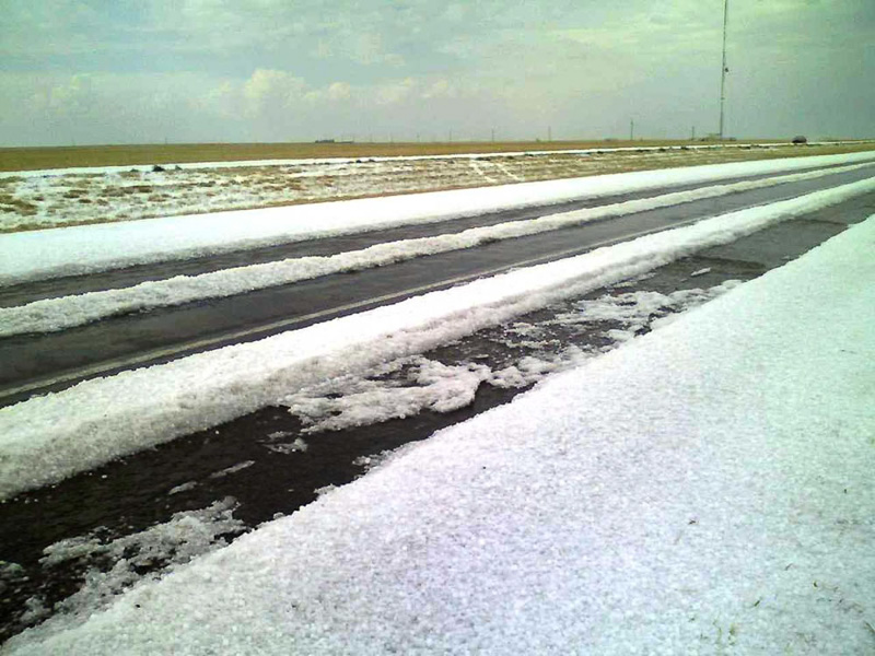 Piles of hail covering the ground after a storm - photo by NOAA