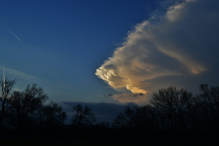 Backside of an anvil at sunset - by NOAA via Unsplash