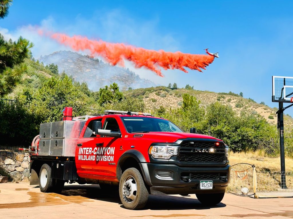 Type 6 brush truck handles things on the ground as a tanker drops retardant on the Quarry Fire. Picture courtesy of the Jefferson County Sheriff Office