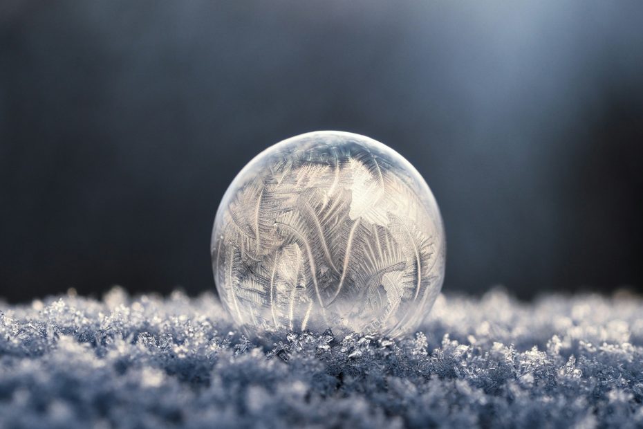 Very cold air freezing a bubble - photo by Aaron Burden via Unsplash